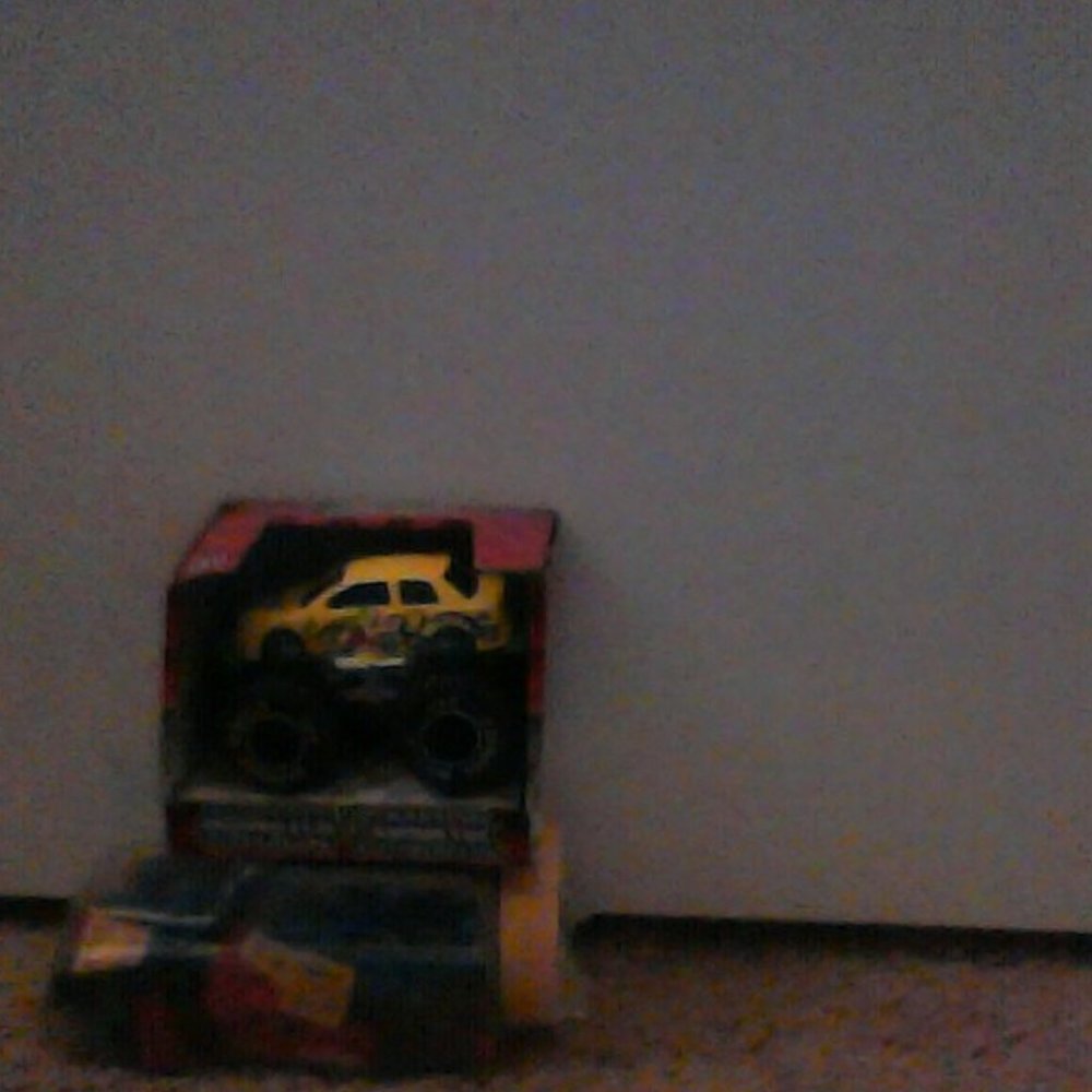 unpackaged monster truck and a car of legos